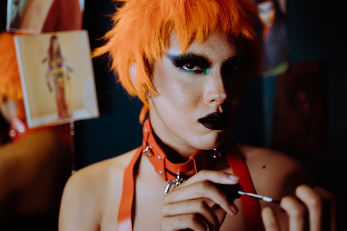 Photo by Kamaji Ogino Crop informal woman painting nails in studio